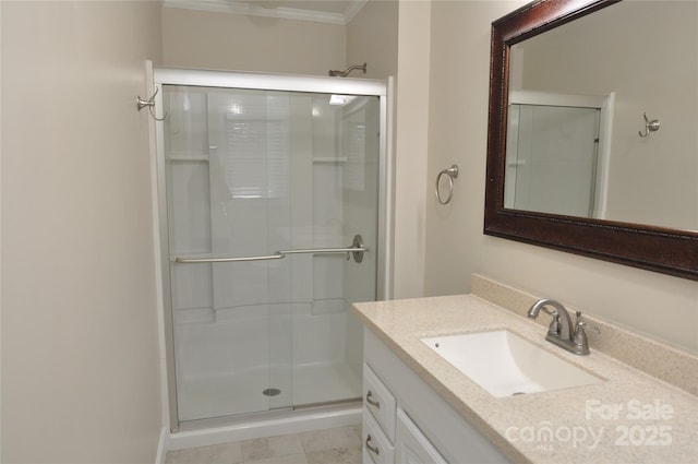 bathroom with vanity, an enclosed shower, and crown molding