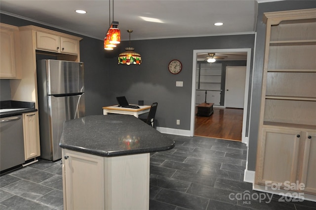 kitchen featuring stainless steel appliances, ceiling fan, crown molding, a kitchen island, and hanging light fixtures