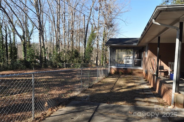 view of yard with a sunroom