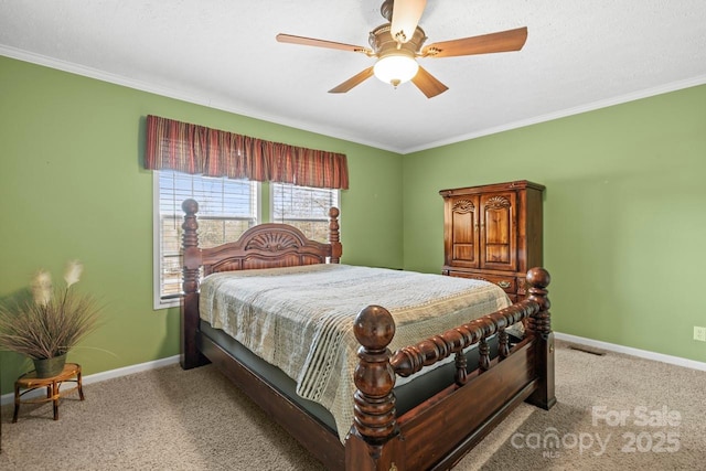 carpeted bedroom with crown molding and ceiling fan