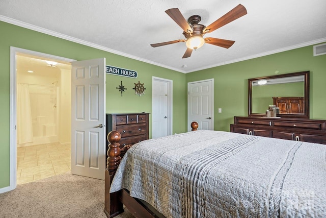 bedroom featuring crown molding, light carpet, ceiling fan, and ensuite bath