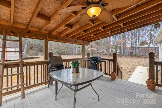 deck featuring a grill and ceiling fan