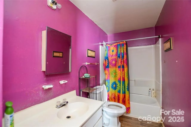 full bathroom with vanity, toilet, shower / bathtub combination with curtain, and wood-type flooring