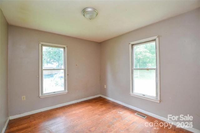 unfurnished room with plenty of natural light