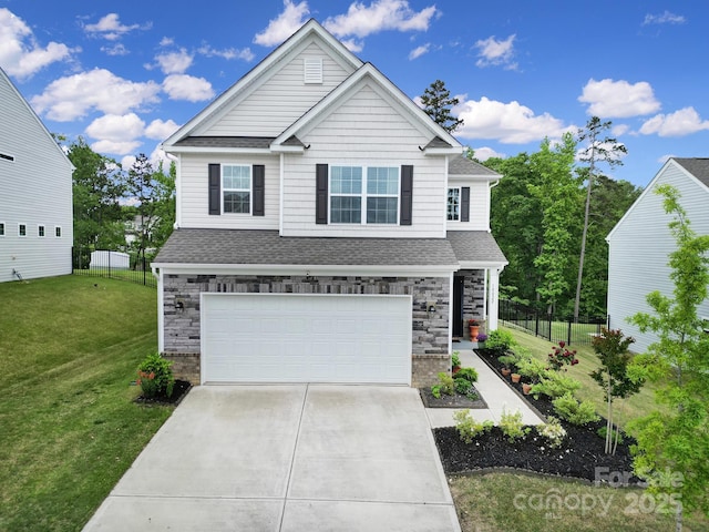 craftsman-style home featuring roof with shingles, stone siding, a garage, a front yard, and driveway