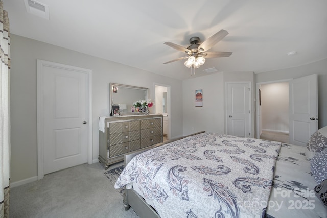 carpeted bedroom featuring a ceiling fan, baseboards, and visible vents