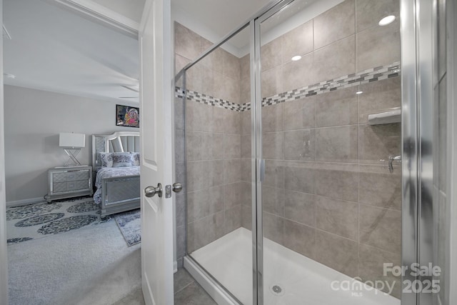 full bath with baseboards and a stall shower