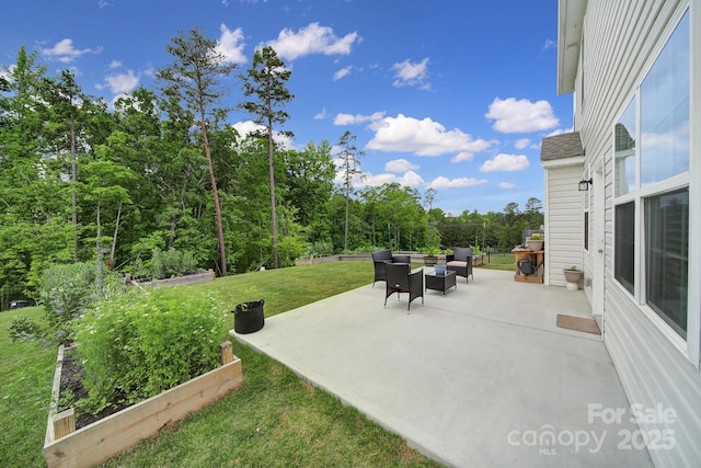 view of patio / terrace featuring outdoor lounge area and a garden