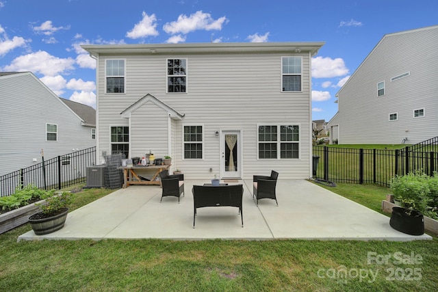 rear view of house with a fenced backyard, a yard, a patio, and cooling unit