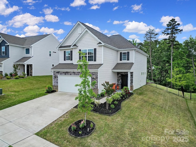 view of front of house featuring fence, roof with shingles, an attached garage, a front yard, and concrete driveway