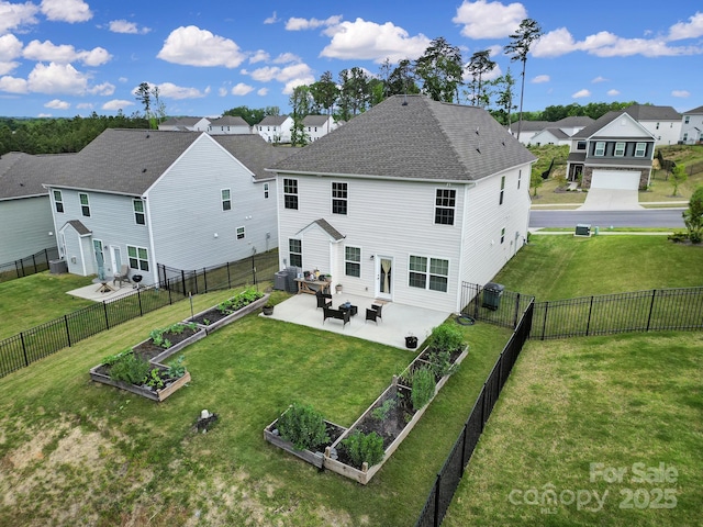 rear view of house with a residential view, a patio area, a vegetable garden, cooling unit, and a fenced backyard