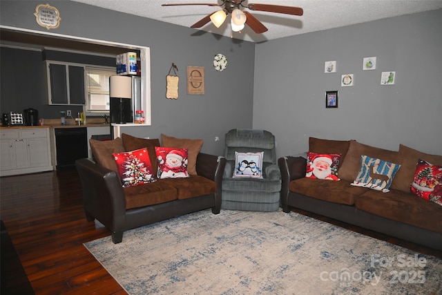 living room with a textured ceiling, ceiling fan, and dark hardwood / wood-style flooring