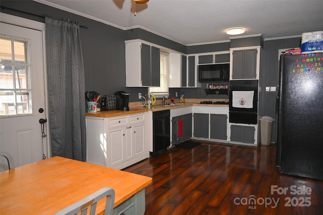 kitchen with black appliances, crown molding, ceiling fan, dark hardwood / wood-style flooring, and white cabinets