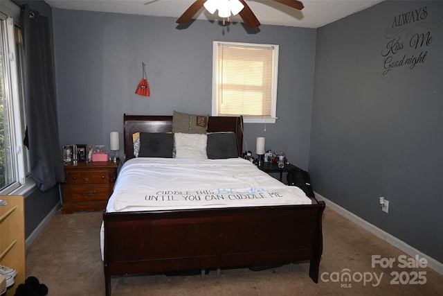 carpeted bedroom featuring ceiling fan