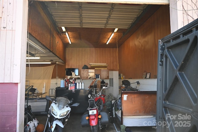 garage with wood walls