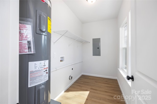 laundry area featuring electric panel, hookup for a washing machine, hookup for an electric dryer, hardwood / wood-style floors, and water heater