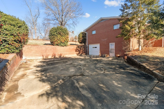 view of side of property featuring a garage