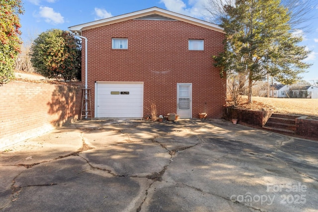 view of property exterior featuring a garage