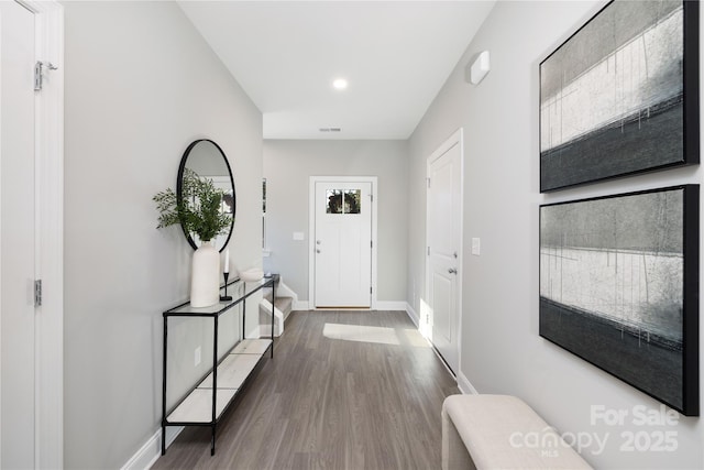 foyer entrance with hardwood / wood-style flooring