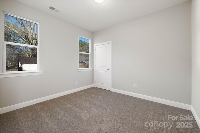 unfurnished room featuring carpet floors