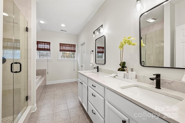 bathroom featuring tile patterned floors, vanity, and independent shower and bath