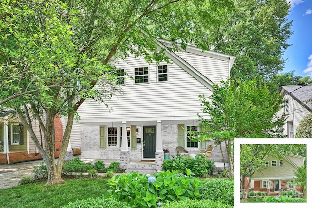 view of front of house with brick siding
