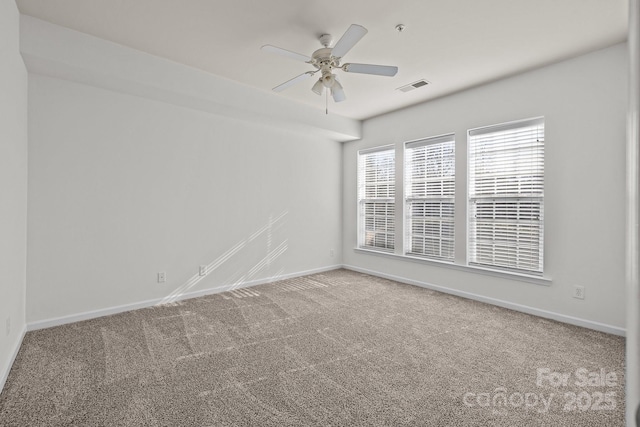 carpeted empty room with ceiling fan