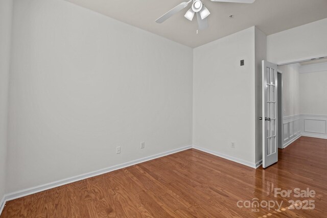 unfurnished room with ceiling fan and hardwood / wood-style floors