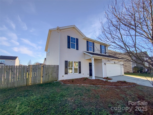 front of property featuring a garage and a front lawn