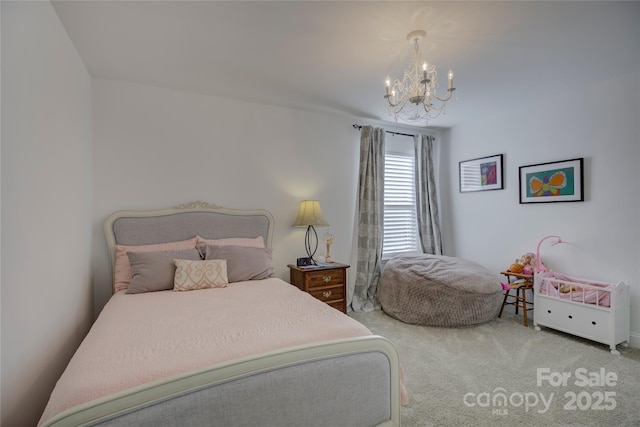 bedroom featuring a notable chandelier and carpet flooring