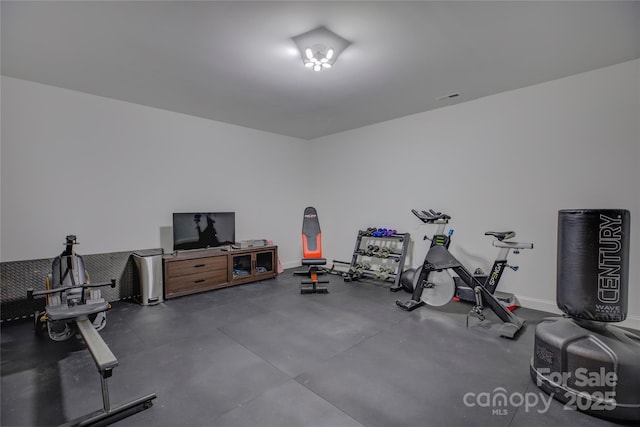 exercise room featuring visible vents and baseboards