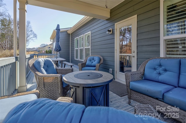 exterior space featuring a deck and an outdoor living space