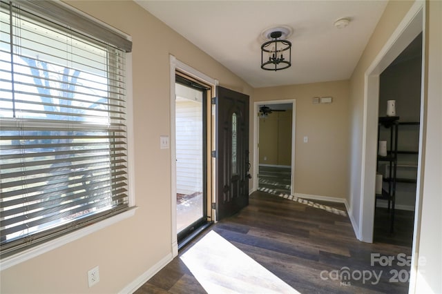 interior space with a wealth of natural light and dark wood-type flooring