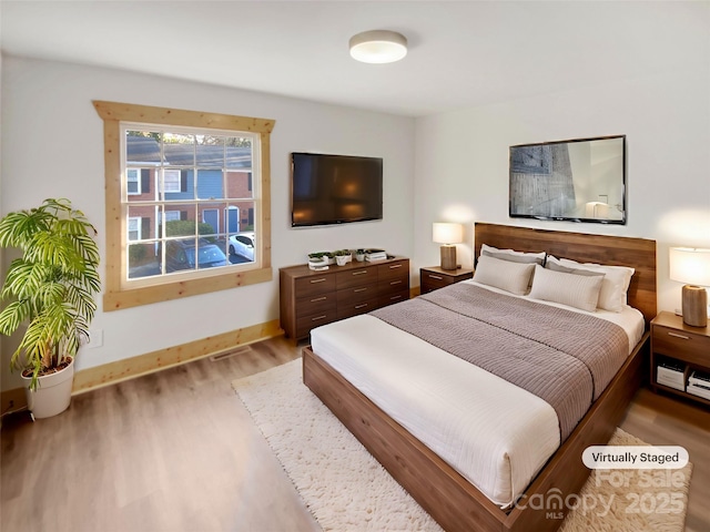 bedroom featuring wood-type flooring