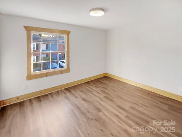 empty room featuring hardwood / wood-style floors