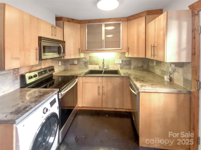 kitchen with sink, light brown cabinets, stainless steel appliances, backsplash, and washer / dryer