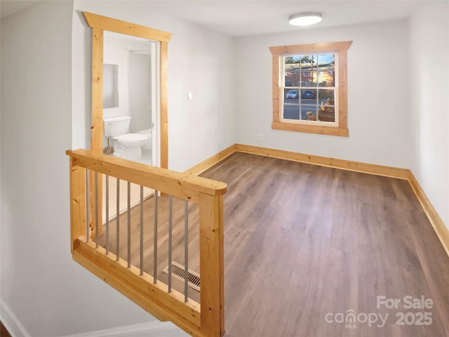 empty room featuring wood-type flooring