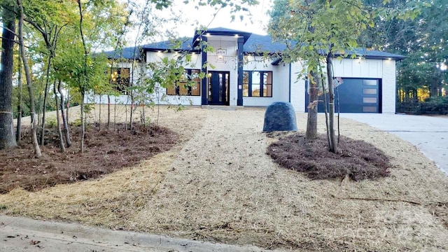 view of front of property with a garage