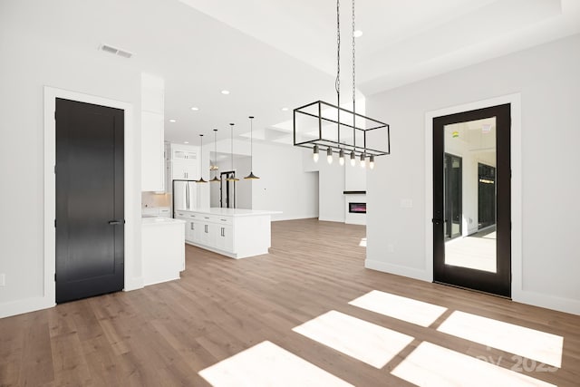 unfurnished living room with light hardwood / wood-style floors