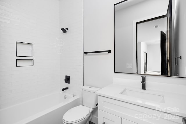 full bathroom featuring vanity, toilet, and tiled shower / bath