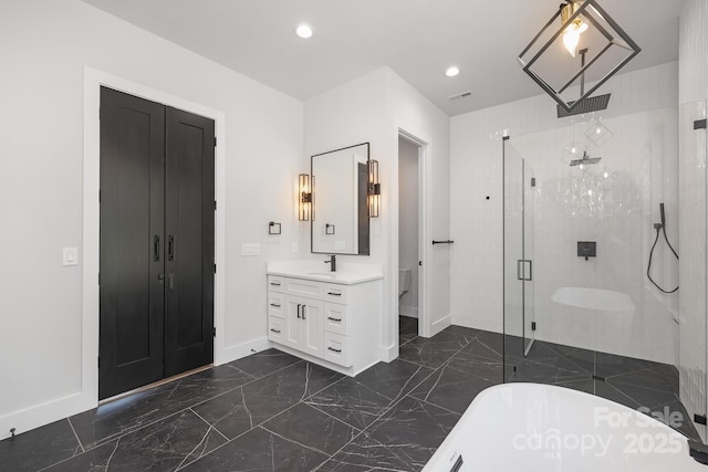 full bathroom featuring vanity, toilet, and independent shower and bath