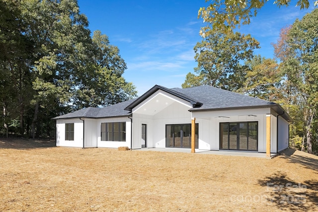 back of property with a patio and ceiling fan