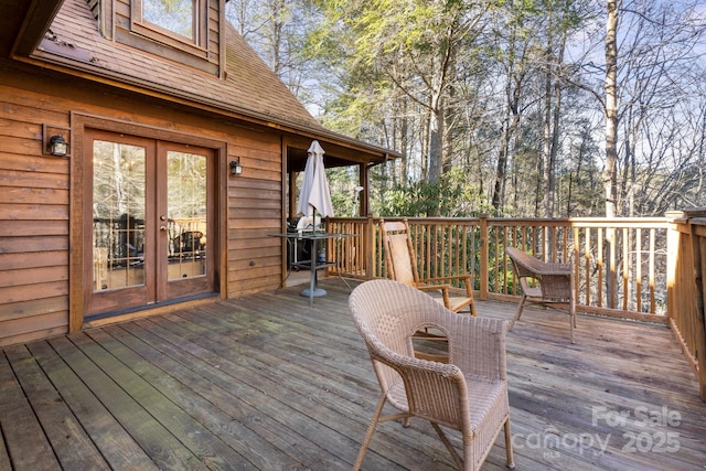 wooden terrace with grilling area and french doors