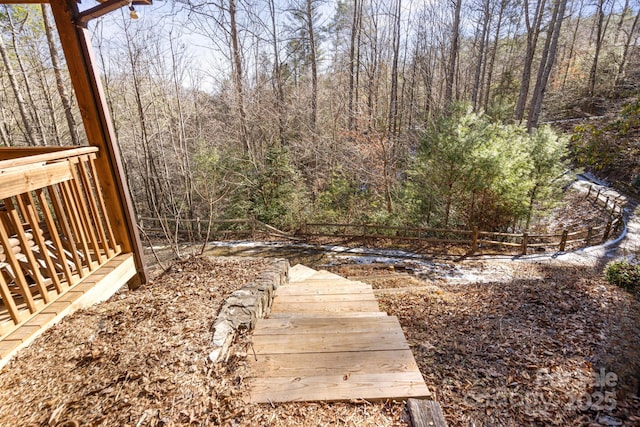 view of yard with a wooded view