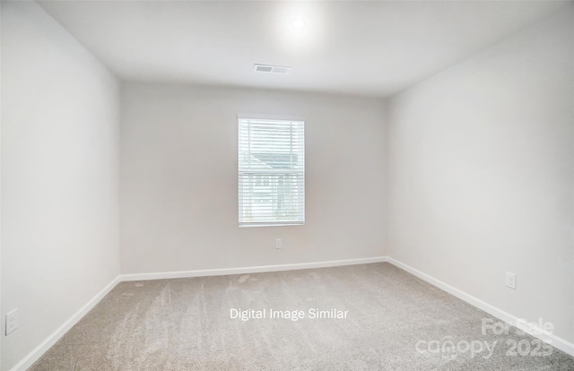 unfurnished room featuring carpet flooring