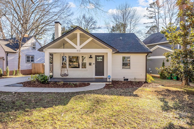 bungalow-style house featuring a front yard and covered porch