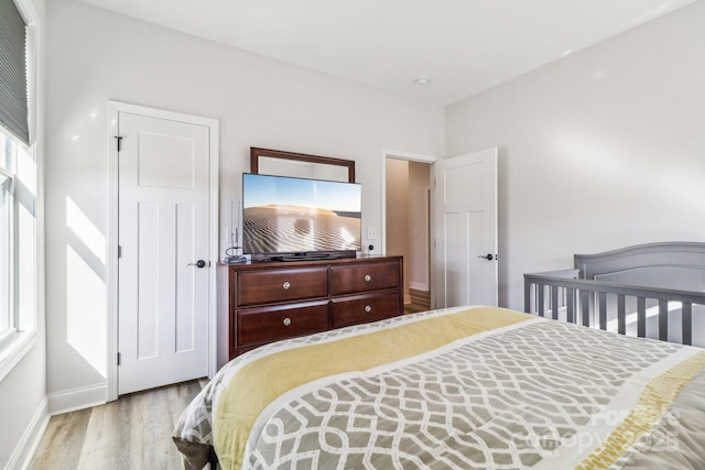 bedroom with light wood-type flooring