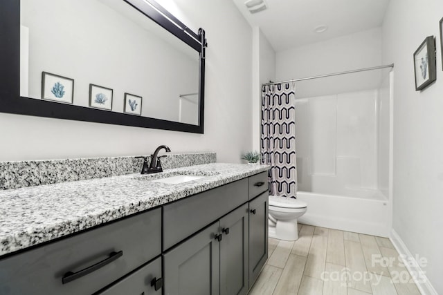 full bathroom with hardwood / wood-style flooring, vanity, toilet, and shower / bath combo with shower curtain