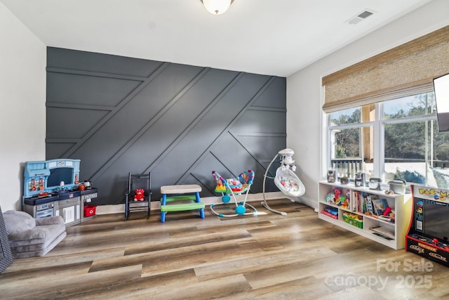 playroom featuring hardwood / wood-style flooring