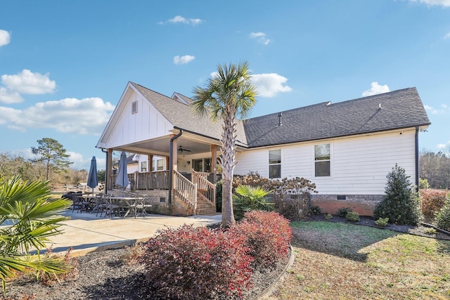 back of property with ceiling fan, a porch, and a patio area